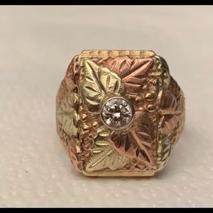 Unisex, 10 karat black hills gold and diamond ring. 10.3 g size 9,  .32 TDW
